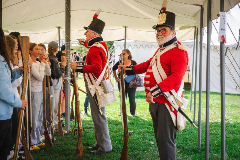 Men wearing traditional British soldier costume